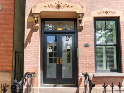 A building with two doors and a window.